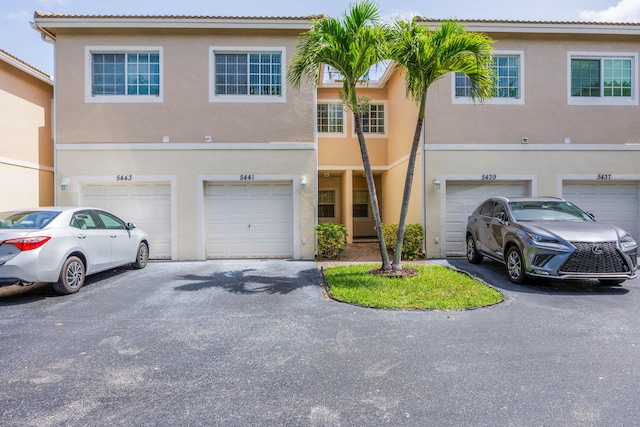 5441 Via Delray Unit 17, Delray Beach, FL 33484 - townhome / multi-family property with driveway, a garage, and stucco siding