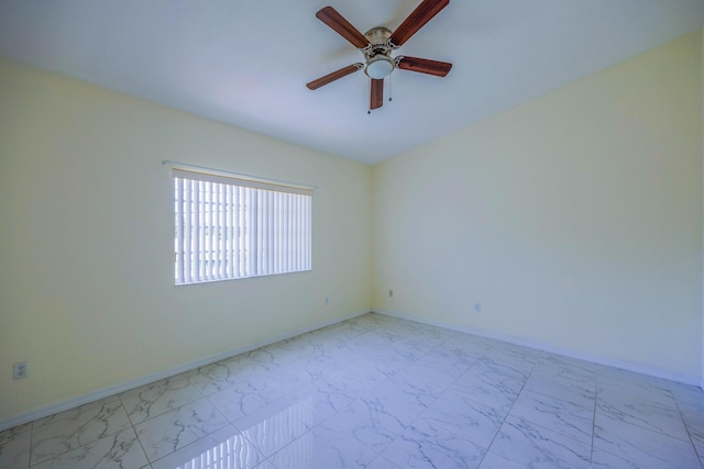 5441 Via Delray Unit 17, Delray Beach, FL 33484 - unfurnished room featuring a ceiling fan, light marble finish floors, and baseboards