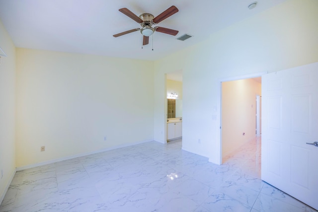 5441 Via Delray Unit 17, Delray Beach, FL 33484 - empty room featuring ceiling fan, light marble finish flooring, and baseboards