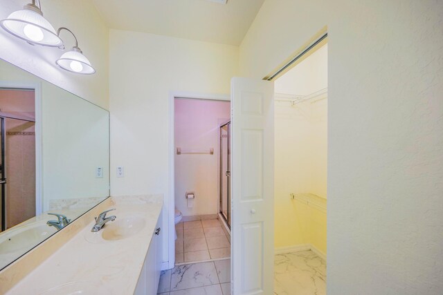 5441 Via Delray Unit 17, Delray Beach, FL 33484 - full bath with toilet, a walk in closet, a shower stall, and double vanity