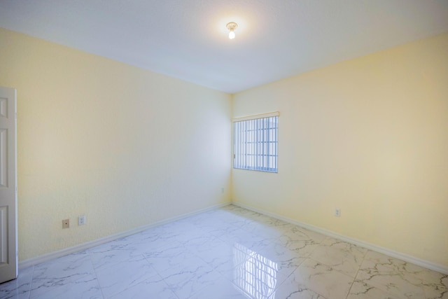 5441 Via Delray Unit 17, Delray Beach, FL 33484 - empty room with light marble finish flooring and baseboards