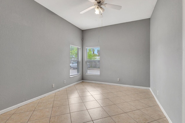 332 S E St, Lake Worth Beach, FL 33460 - unfurnished room featuring a ceiling fan, light tile patterned floors, and baseboards