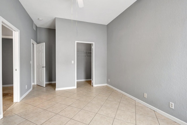 332 S E St, Lake Worth Beach, FL 33460 - unfurnished bedroom featuring light tile patterned floors, a closet, ceiling fan, and baseboards