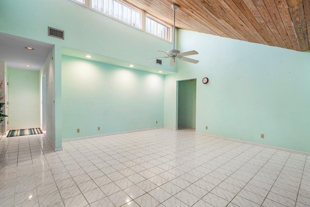 4744 Dolphin Dr, Lake Worth, FL 33463 - empty room with a towering ceiling, ceiling fan, wood ceiling, recessed lighting, and baseboards