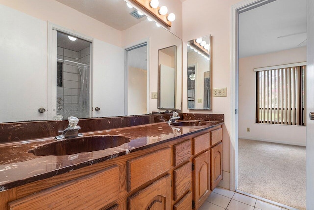 4744 Dolphin Dr, Lake Worth, FL 33463 - full bathroom featuring double vanity, tile patterned flooring, and a shower