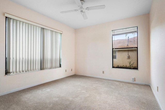 4744 Dolphin Dr, Lake Worth, FL 33463 - empty room featuring carpet floors, baseboards, and a ceiling fan