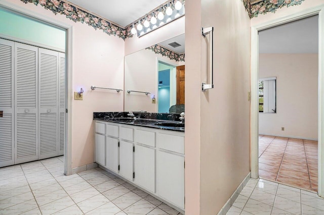 4744 Dolphin Dr, Lake Worth, FL 33463 - full bath with marble look tile flooring, a closet, baseboards, and double vanity