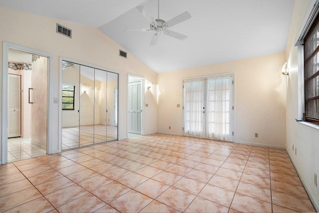 4744 Dolphin Dr, Lake Worth, FL 33463 - empty room with a ceiling fan, vaulted ceiling, and tile patterned floors