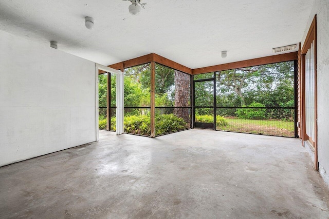 4744 Dolphin Dr, Lake Worth, FL 33463 - unfurnished sunroom with unfinished concrete flooring