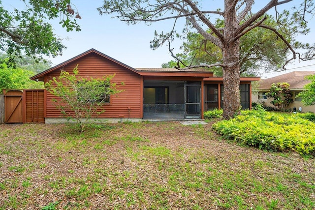 4744 Dolphin Dr, Lake Worth, FL 33463 - back of property with a sunroom