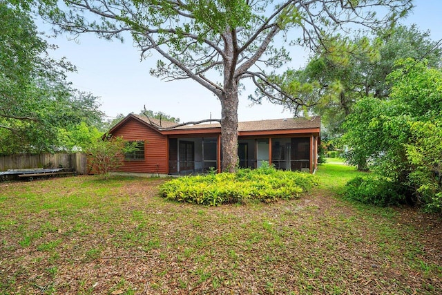 4744 Dolphin Dr, Lake Worth, FL 33463 - rear view of house with a sunroom