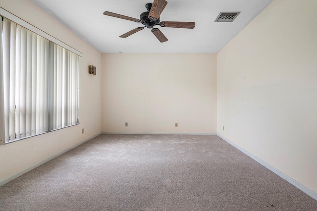 4744 Dolphin Dr, Lake Worth, FL 33463 - empty room featuring light colored carpet, ceiling fan, and baseboards