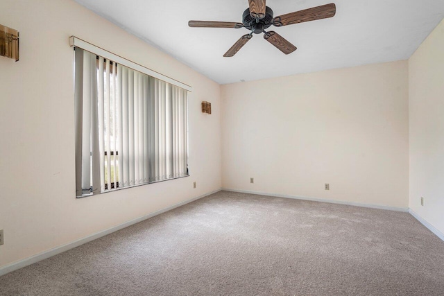 4744 Dolphin Dr, Lake Worth, FL 33463 - spare room with carpet floors, a ceiling fan, and baseboards