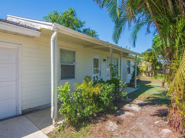 526 NW Kingston St, Port Saint Lucie, FL 34983 - property entrance featuring a garage