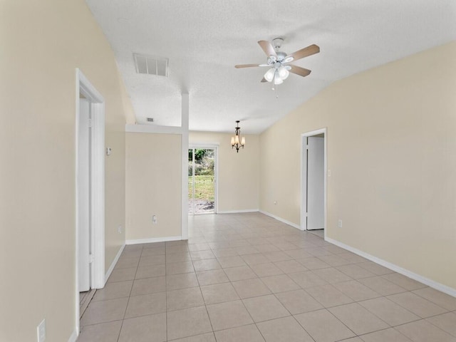 526 NW Kingston St, Port Saint Lucie, FL 34983 - empty room featuring ceiling fan, a chandelier, light tile patterned floors, baseboards, and vaulted ceiling