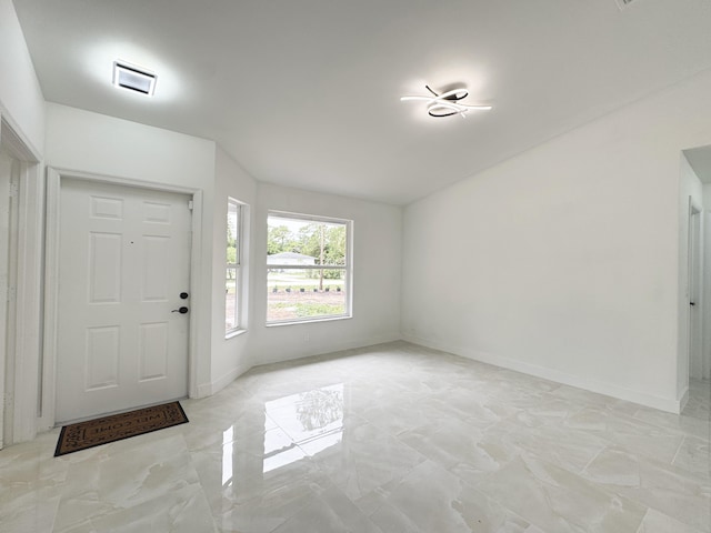 15809 85th Rd N, The Acreage, FL 33470 - entryway with light marble finish flooring and baseboards