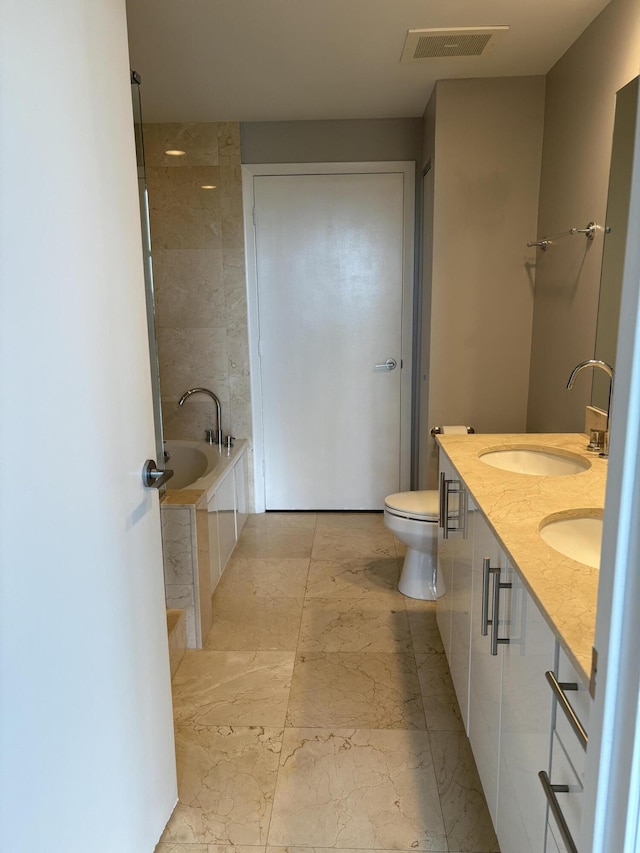 550 Okeechobee Blvd Unit 825, West Palm Beach, FL 33401 - full bathroom featuring tiled tub, double vanity, toilet, and marble finish floors
