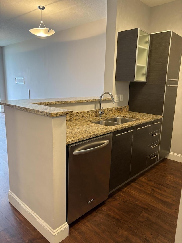 550 Okeechobee Blvd Unit 825, West Palm Beach, FL 33401 - kitchen with stainless steel dishwasher, a sink, dark wood-type flooring, baseboards, and light stone countertops