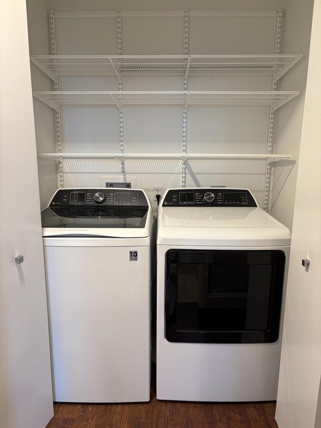 550 Okeechobee Blvd Unit 825, West Palm Beach, FL 33401 - laundry room featuring separate washer and dryer and dark wood finished floors