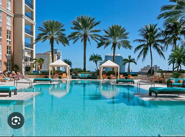 550 Okeechobee Blvd Unit 825, West Palm Beach, FL 33401 - community pool featuring a gazebo and a patio