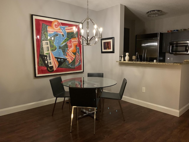 550 Okeechobee Blvd Unit 825, West Palm Beach, FL 33401 - dining area featuring baseboards, wood finished floors, and a chandelier