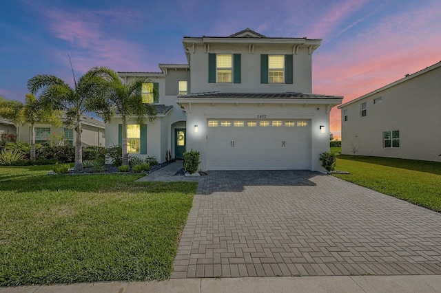 5452 Macoon Way, Westlake, FL 33470 - view of front facade with a garage, stucco siding, decorative driveway, and a lawn