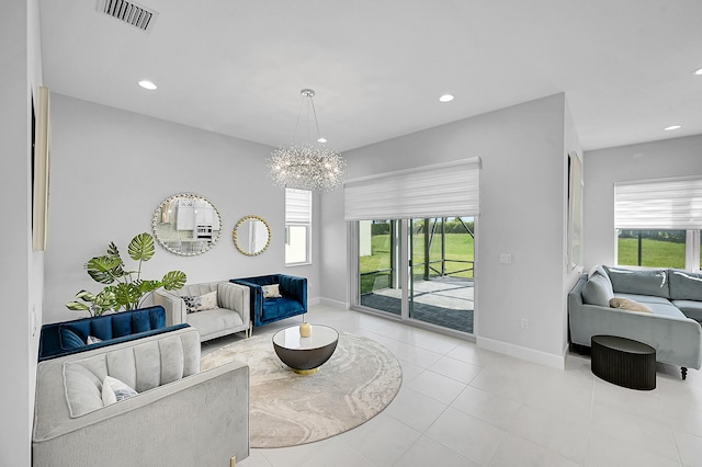 5452 Macoon Way, Westlake, FL 33470 - living area featuring healthy amount of natural light, a chandelier, baseboards, and recessed lighting