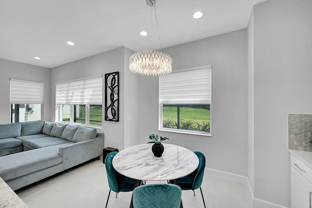 5452 Macoon Way, Westlake, FL 33470 - dining space with healthy amount of natural light, a chandelier, recessed lighting, baseboards, and light tile patterned flooring
