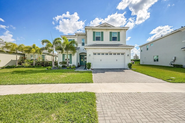 5452 Macoon Way, Westlake, FL 33470 - traditional home featuring decorative driveway, an attached garage, stucco siding, and a front yard