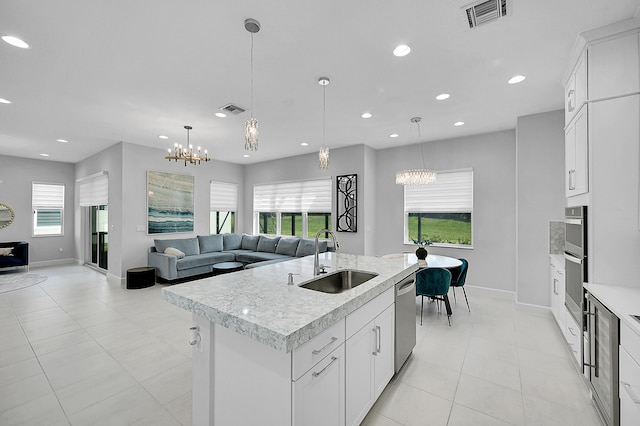 5452 Macoon Way, Westlake, FL 33470 - kitchen featuring a sink, open floor plan, baseboards, a chandelier, and recessed lighting