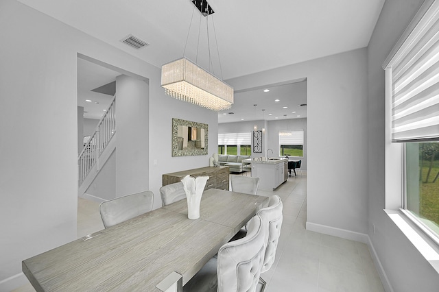5452 Macoon Way, Westlake, FL 33470 - dining space with light tile patterned floors, baseboards, and stairway