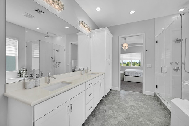 5452 Macoon Way, Westlake, FL 33470 - ensuite bathroom with double vanity, a stall shower, recessed lighting, and baseboards