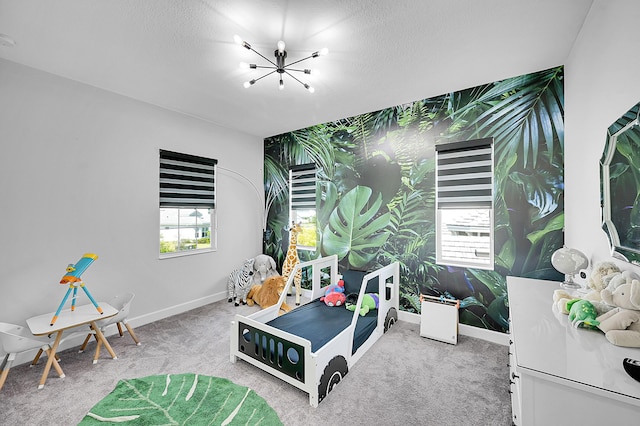 5452 Macoon Way, Westlake, FL 33470 - playroom featuring an accent wall, baseboards, a chandelier, carpet flooring, and wallpapered walls