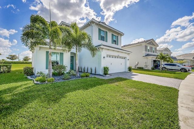 5452 Macoon Way, Westlake, FL 33470 - view of front of house with a garage, driveway, stucco siding, and a front lawn
