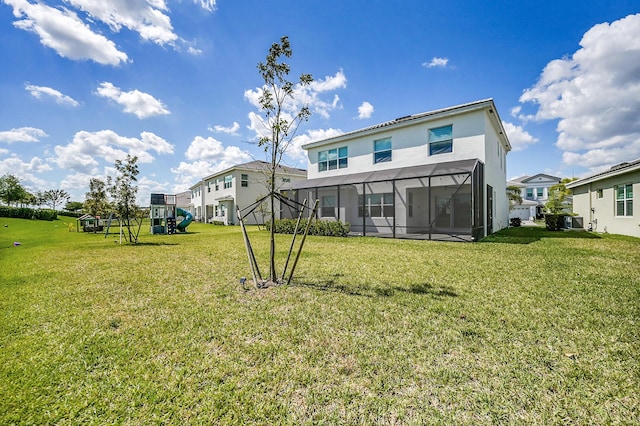 5452 Macoon Way, Westlake, FL 33470 - rear view of house with a playground, a yard, glass enclosure, and a residential view