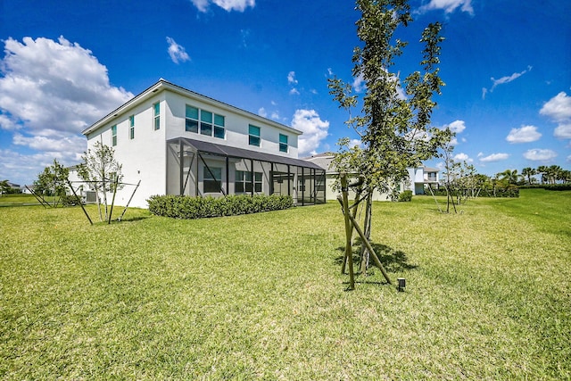 5452 Macoon Way, Westlake, FL 33470 - back of property with a lawn, glass enclosure, stucco siding, and cooling unit