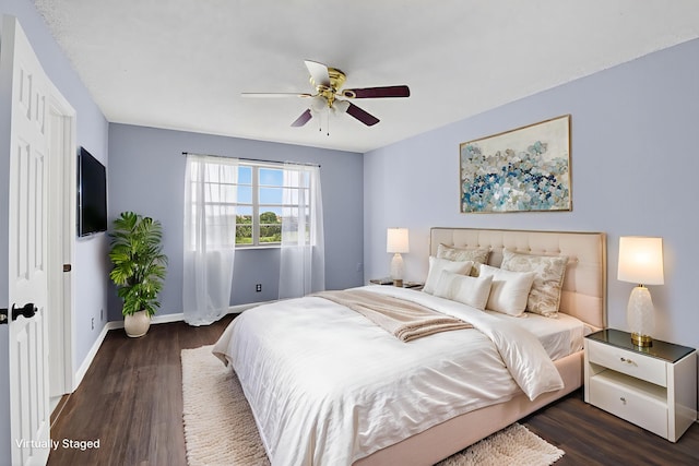9370 SW 8th St Unit 410, Boca Raton, FL 33428 - bedroom with dark wood finished floors, baseboards, and ceiling fan