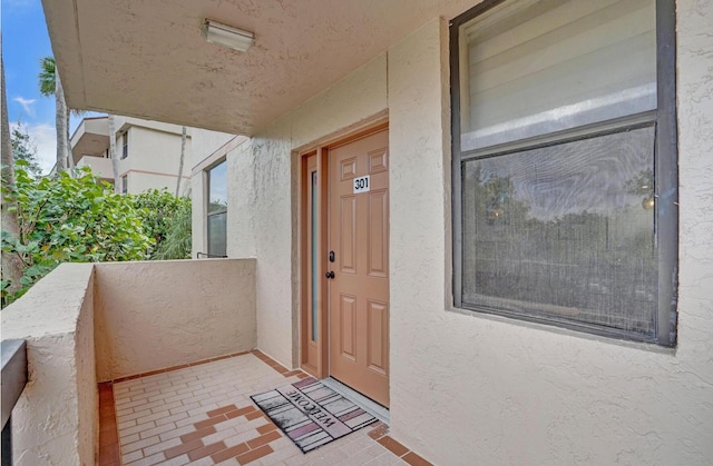 2768 Carambola Cir S Unit 301, Coconut Creek, FL 33066 - property entrance with stucco siding and a balcony