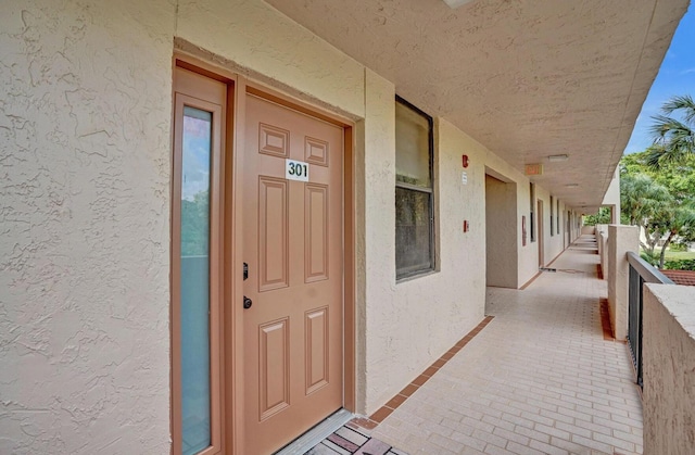 2768 Carambola Cir S Unit 301, Coconut Creek, FL 33066 - entrance to property featuring stucco siding and a balcony