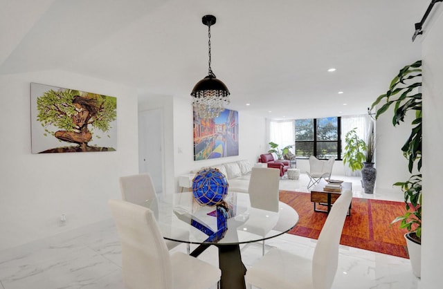 2768 Carambola Cir S Unit 301, Coconut Creek, FL 33066 - dining room with light marble finish floors, recessed lighting, and floor to ceiling windows