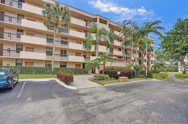 2768 Carambola Cir S Unit 301, Coconut Creek, FL 33066 - view of apartment building / complex featuring uncovered parking