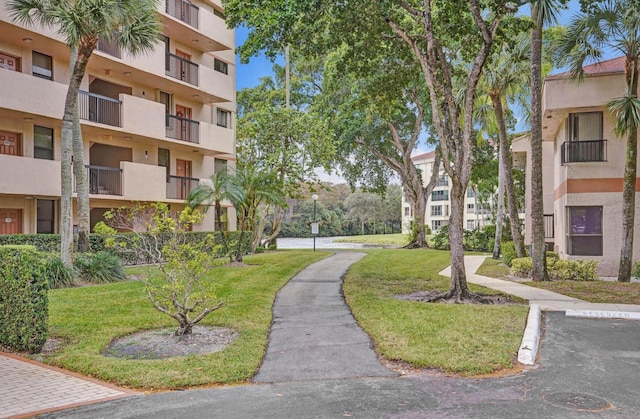 2768 Carambola Cir S Unit 301, Coconut Creek, FL 33066 - view of property's community with a yard