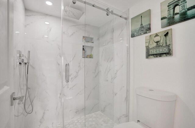 2768 Carambola Cir S Unit 301, Coconut Creek, FL 33066 - bathroom featuring toilet, a marble finish shower, and recessed lighting
