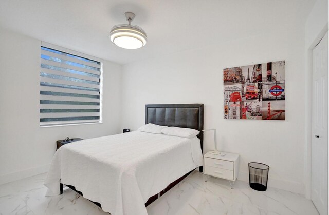 2768 Carambola Cir S Unit 301, Coconut Creek, FL 33066 - bedroom featuring marble finish floors and baseboards