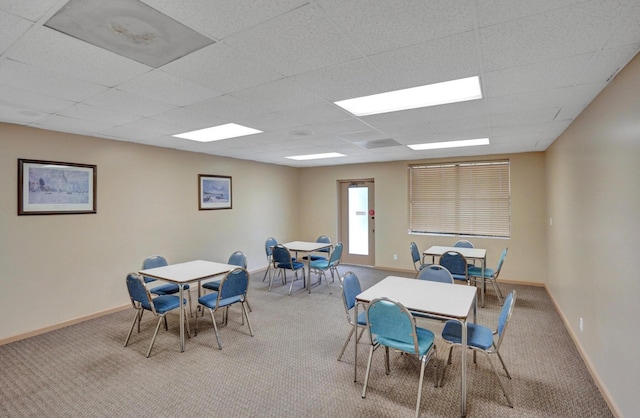 2768 Carambola Cir S Unit 301, Coconut Creek, FL 33066 - dining room with carpet floors, baseboards, and a paneled ceiling