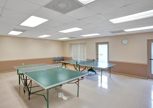2768 Carambola Cir S Unit 301, Coconut Creek, FL 33066 - recreation room featuring baseboards and a drop ceiling