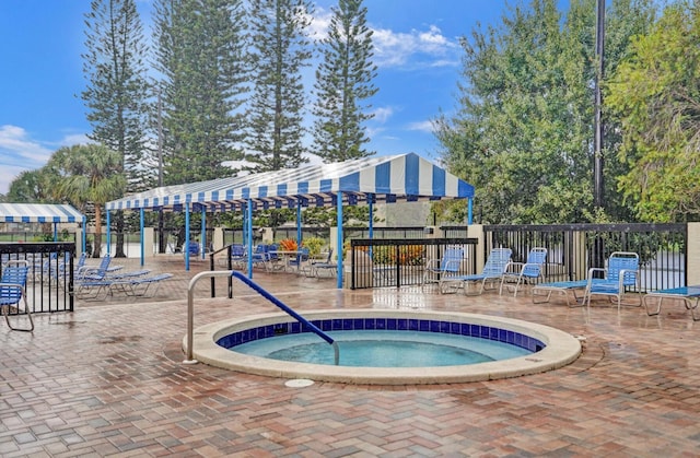 2768 Carambola Cir S Unit 301, Coconut Creek, FL 33066 - view of swimming pool featuring a community hot tub and a pergola