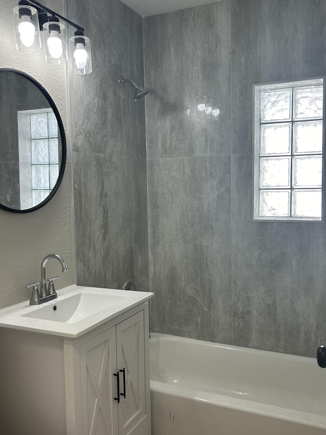 617 54th St, West Palm Beach, FL 33407 - full bathroom featuring shower / washtub combination, vanity, and a textured wall