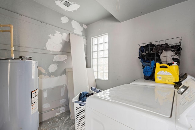 617 54th St, West Palm Beach, FL 33407 - laundry area with electric water heater and washer and clothes dryer
