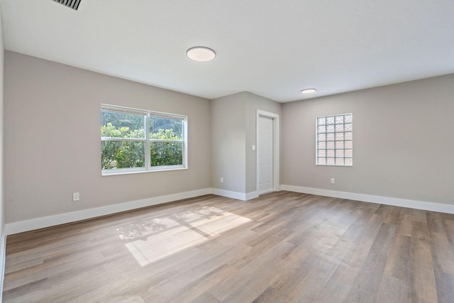 617 54th St, West Palm Beach, FL 33407 - unfurnished room with wood finished floors and baseboards
